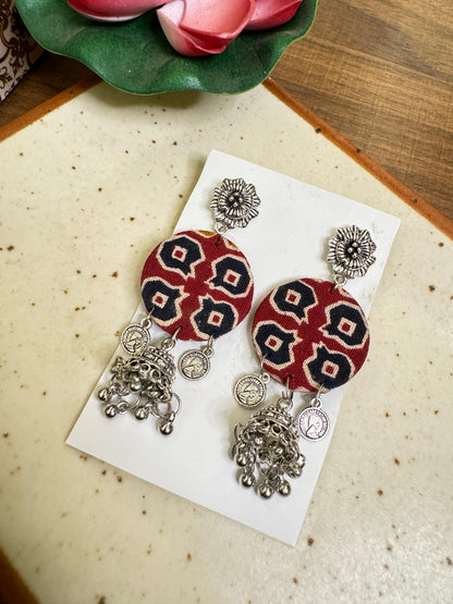 Maroon round jhumka earrings